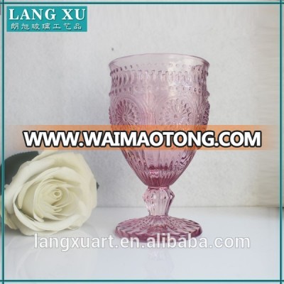 purple colored juice water goblet glass